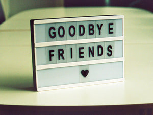 Goodbye Friends sign on a table